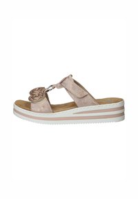 Light pink suede sandals with a floral embellishment, a circular accent, and a layered white and pink wedge sole. Open-toe design.