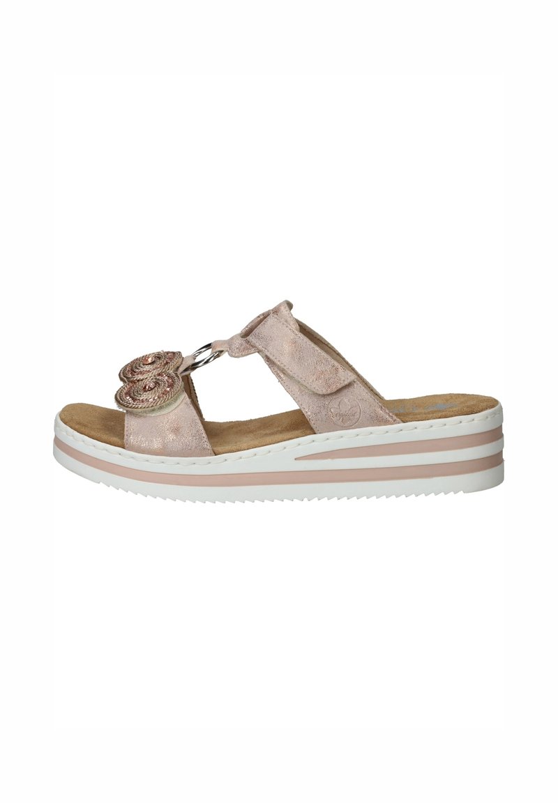 Light pink suede sandals with a floral embellishment, a circular accent, and a layered white and pink wedge sole. Open-toe design.