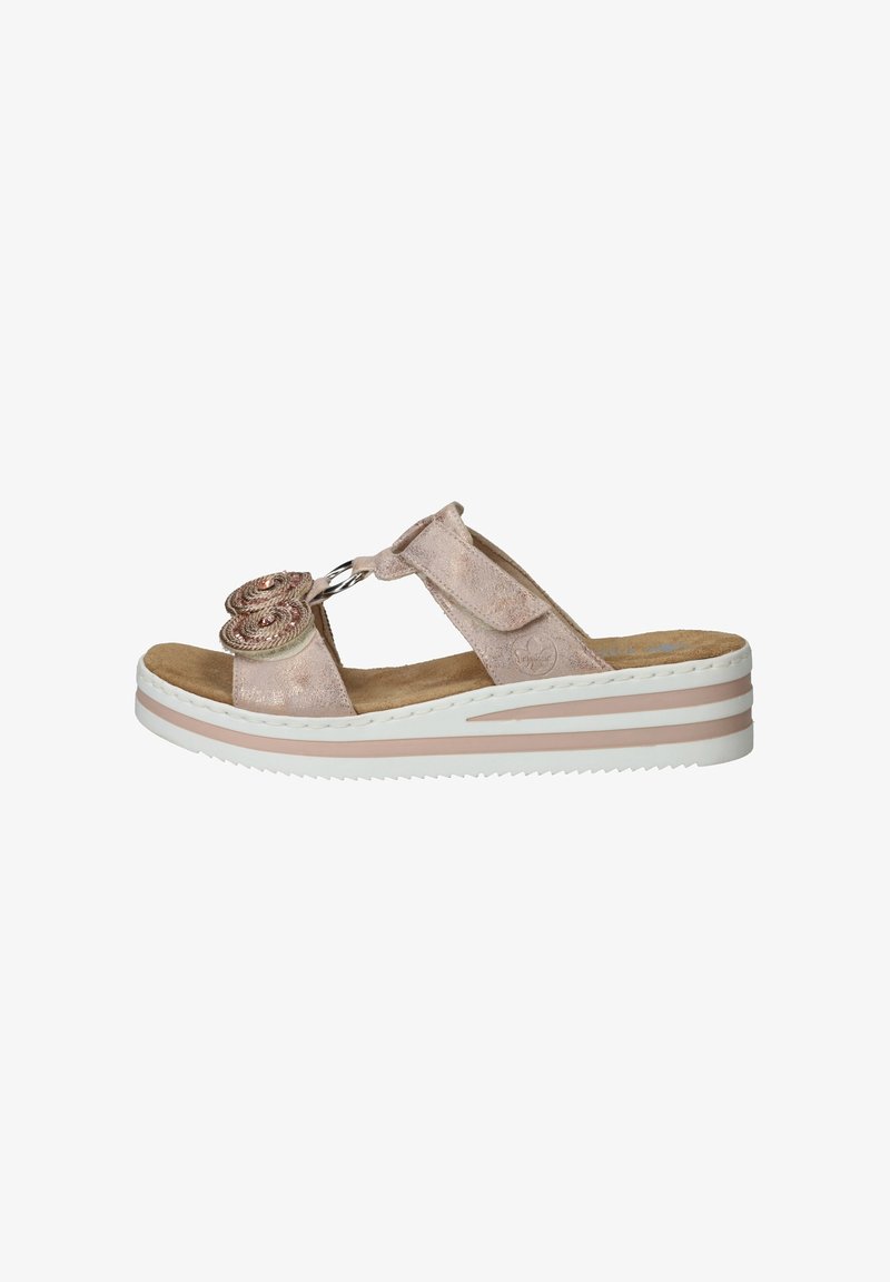 Light pink suede sandals with a floral embellishment, a circular accent, and a layered white and pink wedge sole. Open-toe design.