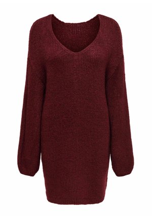 Viininpunainen neulepusero V-kaula-aukolla, pitkillä hihoilla ja väljällä istuvuudella. Siinä on teksturoitu kuvio ja resorit hihansuissa ja helmassa.