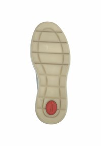 Beige gummisul med lätta grepplinjer, med en röd cirkulär accent märkt "Comfort." Rundad hälkant.