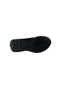 Suola di scarpa da ginnastica nera in gomma texturizzata con lugs esagonali per aderenza. Bordo liscio e leggera curvatura per prestazioni ottimali.