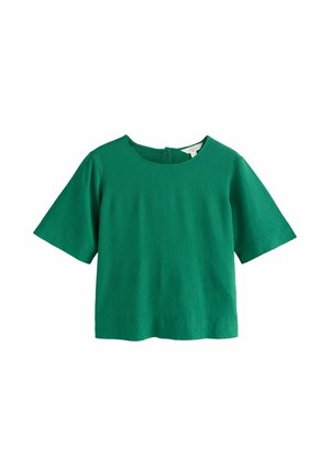 Zielona bluzka z krótkim rękawem, okrągłym dekoltem i zapięciem na guziki z tyłu, wykonana z fakturowanego materiału.