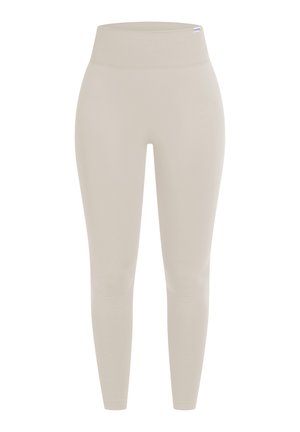 Beige leggings met een hoge, elastische tailleband. Zacht, rekbaar materiaal ontworpen voor comfort en beweging. Volledige lengte met een strakke uitstraling.