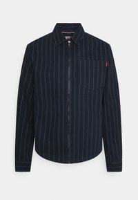 Navy blue zip-up jacket with vertical white stripes, featuring a collared neck, long sleeves, and a chest pocket.