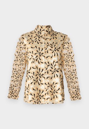 Beige skjorta med intrikat svart blommösterbroderi, transparenta ärmar, rak skärning och krage med knappstängning.
