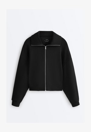 Black zip-up jacket with wide collar, long sleeves, and ribbed cuffs, displayed flat on a white background.