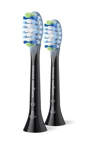 Deux têtes de brosse à dents Philips Sonicare C3 noires présentent des poils bleu, bleu clair et vert, conçus pour un enlèvement efficace de la plaque dentaire et un soin des gencives.