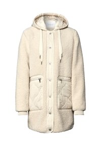 Chaqueta con capucha de color crema con un exterior suave y esponjoso, bolsillos de tela acolchada y cierre de botones a presión con detalles de cordón.