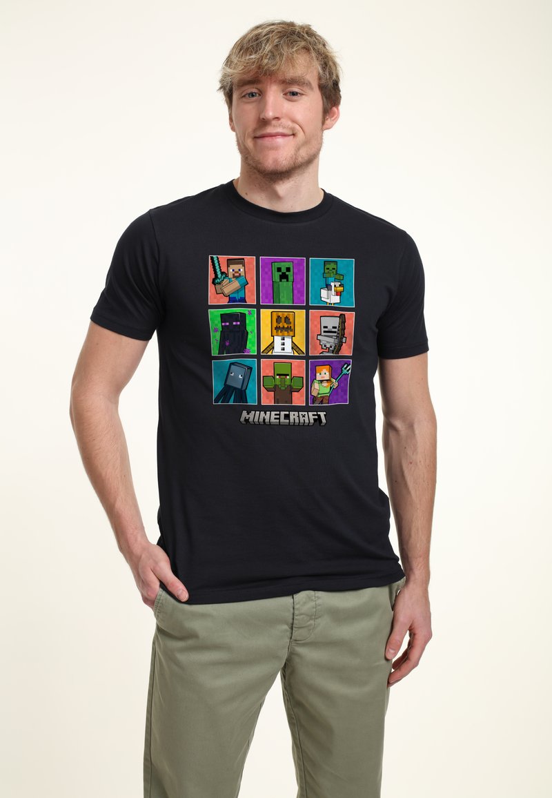 Black cotton t-shirt featuring a colorful Minecraft-themed graphic with pixelated characters arranged in a grid pattern.