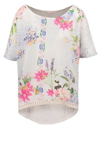 Floral-patterned short-sleeve top with a light gray base, lace trim, and pastel flowers in pink, blue, and green. Rounded hem design.