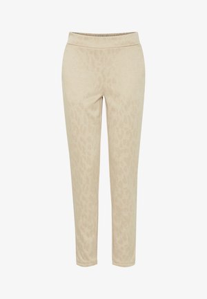 Beżowe spodnie dresowe wykonane z miękkiego materiału z delikatnym wzorem w panterkę, z elastycznym pasem i zwężanym krojem nogawek.