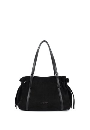 Sac à main en daim noir Lancaster avec doubles poignées en cuir et détails avec cordons sur les côtés, logo visible au centre devant.