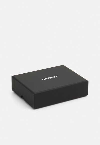 Black rectangular box, matte finish, with a small hole on one side. Features "DARKAI" printed in white on top. Simple and compact design.