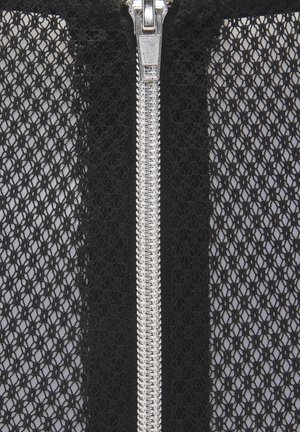 Black lace fabric with a geometric pattern, featuring a silver zipper along the center for closure. The texture appears delicate and open.