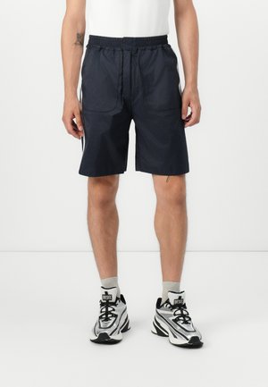 BERMUDA UNISEX - Tracksuit bottoms - blue/white