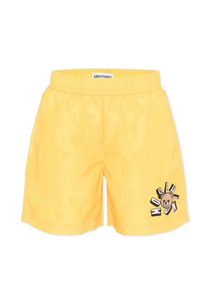 Shorts gialli con vita elasticizzata, con una piccola faccia di orso e la scritta "Moschino" sulla parte inferiore della gamba destra.