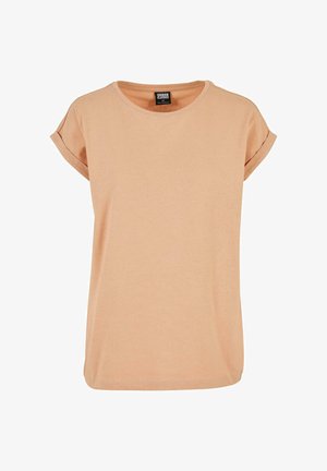 ferskenfarvet bomulds T-shirt med rund hals, optrækkede korte ærmer og en afslappet pasform. Glat tekstur og enkelt design.