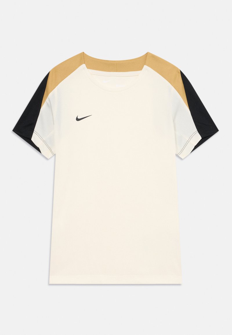 Camiseta blanca de manga corta con acentos en beige y negro en los hombros. Presenta el logo de Nike en negro en el pecho. Tejido suave y ligero.