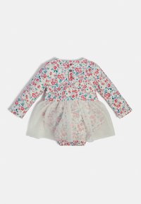 Kwiatowy kombinezon z długimi rękawami, z białą tiulową spódnicą na wierzchu. Miękka tkanina, wielokolorowy wzór kwiatowy i zapięcie na guziki z tyłu.