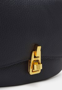 Coccinelle MAGIE SOFT - Handbag - midnight blue