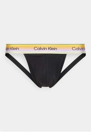 Suspensorio para hombre negro con banda de cintura degradada de amarillo a púrpura, con el logo repetido de Calvin Klein en fuente negra.