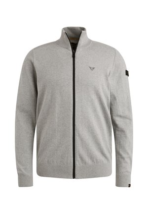 Sivi zip-up dukserica izrađena od pletenog materijala. Ima visoki ovratnik, dugačke rukave i zatvaranje na patentni zatvarač. Crni naglasci uz patentni zatvarač.