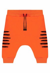 Pomarańczowe szorty dresowe z szarym sznurkiem i czarnymi dekoracyjnymi paskami po bokach. Wykonane z miękkiego, rozciągliwego materiału.