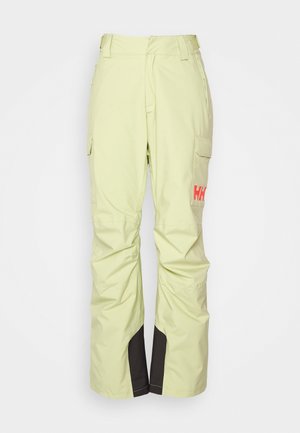 Pantalones de esquí verde claro con un corte recto, que cuentan con bolsillos cargo y un panel oscuro en el tobillo. Incluye un logo naranja en la pierna.