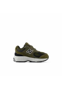 Dark green and black athletic shoe with mesh and suede materials, featuring a prominent white logo and a textured black rubber sole.