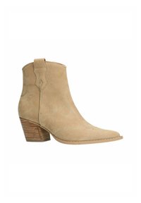 Tan suede ankle boot with a pointed toe, decorative stitching, and a stacked wooden heel. Features a curved cut design at the collar.