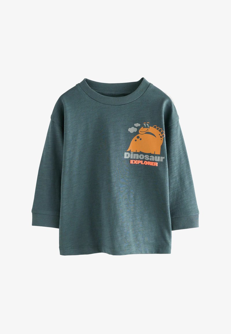 Vihreä pitkähihaisuus paita, joka on valmistettu pehmeästä kankaasta ja siinä on oranssi dinosauruksen graafinen kuva, jonka alla lukee valkoisella "Dinosaur Explorer".
