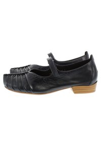 Scarpe Mary Jane in pelle nere. Caratterizzate da una punta arrotondata e dettagli arricciati nella parte anteriore. Tacco basso in legno. Cinturino sul dorso del piede.