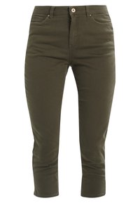Pantalones verdes oliva de tiro medio, hechos de una mezcla de algodón. Cuenta con cierre de cremallera y botón, cinco bolsillos y un diseño ajustado.