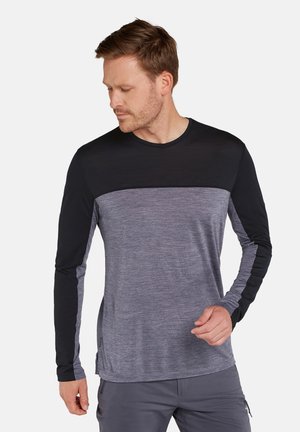 Långärmad skjorta med en svart övre sektion och en grå, strukturerad nedre sektion. Slät tyg med rund halsringning och figurnära design.