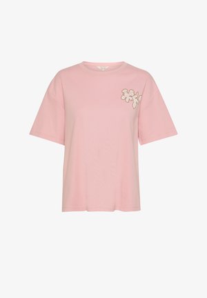 Růžové bavlněné tričko s krátkým rukávem, se květinovou výšivkou vlevo, kulatým výstřihem a volným střihem.