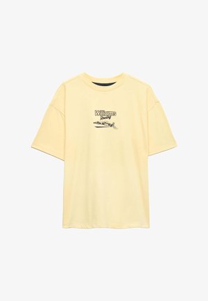 Lys gul t-shirt med korte ærmer med teksten "Williams Racing" og et sort-hvidt racerbils-grafik på frontens midte.