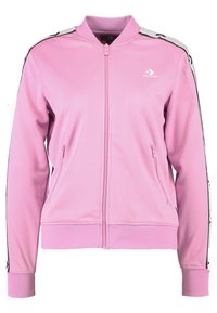 Pink zip-up jacket made of smooth synthetic material. Features black side accents, a ribbed collar, and two front pockets.