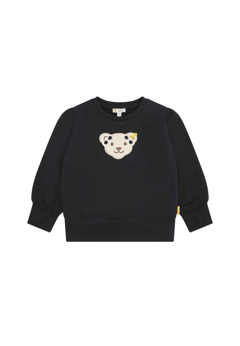 Schwarzes Sweatshirt mit puffärmel, mit einem cremefarbenen und gelben Bärenkopf-Logo auf der Vorderseite und einem seitlichen Etikett.
