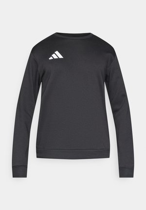 Musta pitkähihaisen pehmeästä kankaasta valmistettu collegepaita, jossa on pyöreä pääntie ja valkoinen Adidas-logo vinoviivoilla vasemmassa yläreunassa rinnassa.