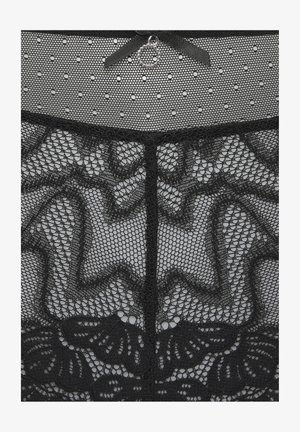 Schwarzer durchsichtiger Spitzenstoff mit Blumen- und gewellten Mustern, polka-dot Netzoberteil und eine kleine dekorative Schleife mit einem runden Anhänger.