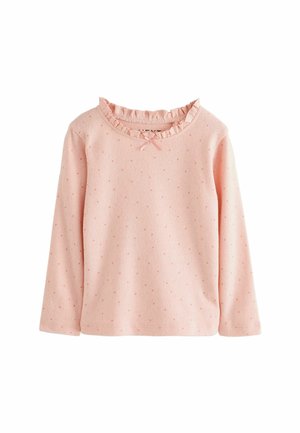 Camicia a maniche lunghe rosa chiaro, con colletto volante e dettaglio a fiocco, decorata con punti testurizzati su tutta la stoffa. Materiale in cotone morbido.