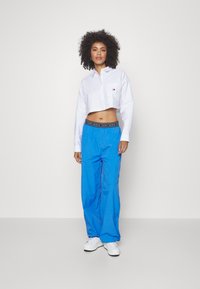 Tommy Jeans - Spodnie materiałowe