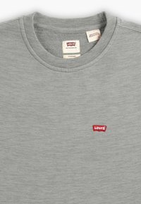 Gray cotton sweatshirt with a round neckline and a small red Levi's logo on the chest. Features a textured, soft fabric.