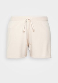 Shorts en coton beige avec une taille à cordon, présentant une texture douce et une coupe droite. Sans poches ; l'ourlet se termine juste au-dessus du genou.