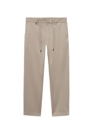 Béžové joggingové kalhoty s elastickým pasem na šňůrku, dvěma bočními kapsami a tapered (zúženým) střihem, vyrobené z texturované, lehké tkaniny.