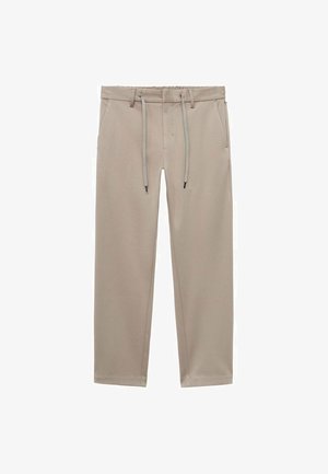 Béžové joggingové kalhoty s elastickým pasem na šňůrku, dvěma bočními kapsami a tapered (zúženým) střihem, vyrobené z texturované, lehké tkaniny.