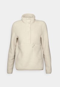 Fleece pullover i off-white, med høj krave, knappelukning og en frontlomme med lynlås. Stoffet har en blød, struktureret finish.