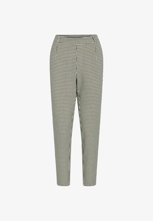 Pantalons à carreaux noir et blanc avec une taille élastique, jambes fuselées et une texture de tissu lisse. Pas de poches visibles.