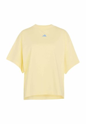 Żółta oversizeowa koszulka wykonana z bawełny. Posiada okrągły dekolt, krótkie rękawy oraz małe niebieskie logo na środku u góry.